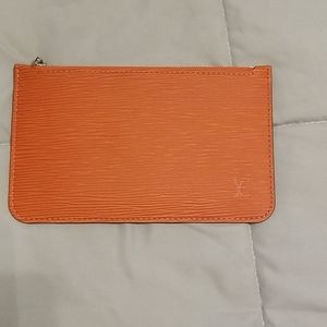 Authentic Louis Vuitton orange epi pouch.